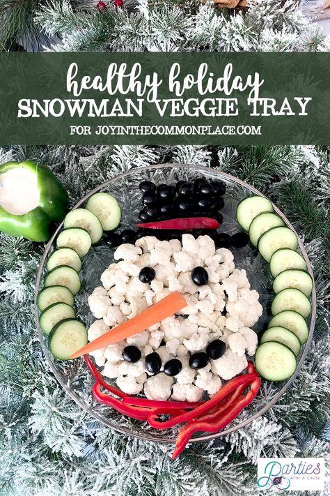 Serve a side of ranch for the perfect combo. Lighten up your holiday table this season with an easy Snowman Veggie Tray tutorial. Healthy party food doesn't have to be tough. Turn your vegetables into food art and make healthy food fun for kids and adults! Designed by Parties With A Cause for Joyinthecommonplace.com #healthypartyfood #snowman #christmasfood #veggietray #foodart Essen, Christmas Veggie Tray, Healthy Christmas Snacks, Healthy Party Food, Fruit And Vegetable Carving, Vegetable Carving, Healthy Christmas, Holiday Snowmen, Veggie Tray