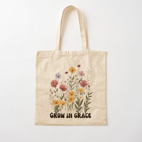 Get my art printed on awesome products. Support me at Redbubble #RBandME: https://www.redbubble.com/i/tote-bag/Grow-in-Grace-with-Wildflowers-Bible-Verse-Women-Christian-Gifts-Faith-Shirt-Religious-Wildflower-gift-Gift-for-her-by-Noemill/161700527.P1QBH?asc=u Diy Christian Tote Bag Painting Ideas, Christian Tote Bags Paint, Bible Tote Bag Painting Ideas, Tote Bag Painting Ideas Christian, Bible Bags Totes Diy, Painting Tote Bag Ideas, Bible Verse Women, Bible Tote Bag, Painted Canvas Bags