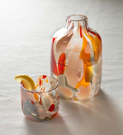 Our multi-colored infused glass carafe combines pitcher and tumbler in a clean-lined design. The tumbler acts as a lid over the free-formed carafe, keeping your beverage free from dust. Made with hand-blown recycled glass, this minimalistic design makes a practical and unique bedside companion. Also ideal in the guest room, bath, dining room, and office. V7525,Recycled Glass Carafe and Glass Tumbler,Tortoise colored glassware,nightstand glass,handblown carafe and Carafe And Glass Set, Blown Glass Cups, Colored Glass Decor, Hand Blown Glass Cups, Water Glass Design, Glass Blowing Beginner, Carafe With Cup, Unique Drinking Glasses, Ceramic Carafe