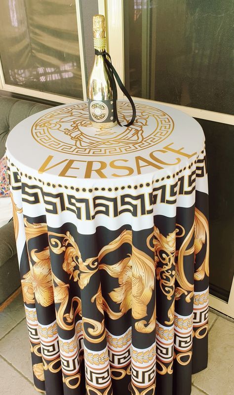 Custom "Versace" themed table cloths and champagne bottle centerpieces 🍾 Versace Party Theme, Versace Theme Party Ideas, Narco Theme Party Decorations, Narcos Theme Party, 21st Party Themes, Versace Party, Custom Versace, Diy Party Themes, Luxury Birthday Party