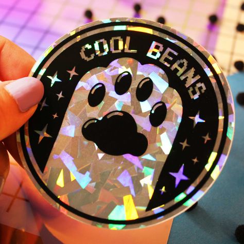 These holographic stickers are perfect for adding a touch of sparkle to your notebooks, laptops, or water bottles. They're also great for giving as gifts! #holographicstickers #coolbeans . #Cute_Cricut_Stickers #Holo_Stickers #Paw_Sticker #Vinyl_Paint Cute Cricut Stickers, Holo Stickers, Paw Sticker, Cool Beans, Stickers Cool, Vinyl Painted, Sticker Design Inspiration, Packaging Ideas Business, Holographic Stickers