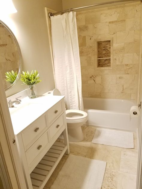 Small bathroom remodeled with travertine walls and floor. Beige Tiles In Bathroom Ideas, Bathroom With Cream Tub And Toilet, Bathroom Decor With Tan Tile, Travertine And White Bathroom, Bathroom With Beige Tile Walls, Small Bathroom Ideas Brown Tile, Bathrooms With Travertine Tile, Light Tan Tile Bathroom, Beige Floor Bathroom Ideas