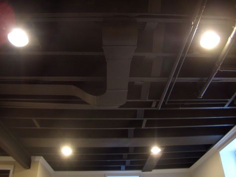 Inexpensive and neat alternative to drop ceilings in basement. Its the unfinished, finished look. LOVE IT! Black Basement Ceiling, Basement Ceiling Ideas Cheap, Unfinished Basement Ceiling, Exposed Basement Ceiling, Basement Ceiling Painted, Drop Ceilings, Basement Ceiling Options, Industrial Basement, Low Ceiling Basement