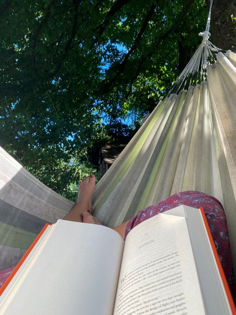 A book on legs in a green hammock Reading Hammock Aesthetic, Garden Hammock Aesthetic, Summer Hammock Aesthetic, Hammock Reading Aesthetic, Reading In A Hammock, The Bronzed Beasts, Reading In Hammock, Reading Hammock, End Of Summer Aesthetic