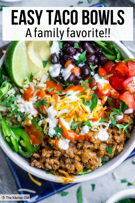 Taco bowl with taco meat, tomatoes, black beans, rice, cheese, sour cream, avocado, and lime. Title: Easy Taco Bowls: A Family Favorite!! Taco Meat Lunch Ideas, Recipes For Taco Tuesday, Easy Taco Bowl Recipe, Meals In A Bowl Recipes, Healthy Taco Bowl Meal Prep, Chicken Taco Bowls Healthy, Mexican Bowl Recipe Healthy, Taco Bowls Ground Beef, High Protein Taco Bowl