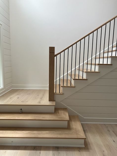 Another finished project! We love how this white oak and painted wood staircase turned out! This contemporary staircase is a gorgeous addition to this home. It uses a mixture of white oak, painted wood and iron stair parts. It also features a custom square wooden newel post with a decorative groove added. Interested in a similar style staircase for your home? Follow the link below to learn what stair parts were used. Stairs Painted White, Wood Stair Treads, Oak Handrail, Stair Posts, Staircase Landing, White Staircase, Painted Staircases, Wood Handrail, Contemporary Staircase