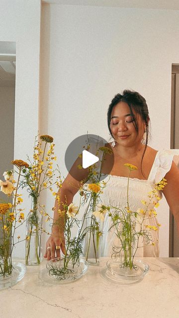 Kimberly Anne on Instagram: "Slow mornings making floral arrangements at home is one of my life's small joys 🌼

White dress: @frenchconnectionus
Earrings: @anthropologie
Floral frogs: @amazonhome

#wholesomegirlsummer #floralfrogs
#flowerarrangements #floralfix #flowersofinstagram
#coastalgrandmother #coastalgrandmotheraesthetic
#pinterestgirl

Floral decor, white dress, ruffle sleeve dress, yellow flowers, small yellow florals, party host, event planning, wedding decor" Floral Frog Arrangement Wedding, Flower Frog Arrangement, White Dress Ruffle, Floral Frogs, Small Joys, Planning Wedding, Ruffle Sleeve Dress, Flower Frog, Winter Flowers