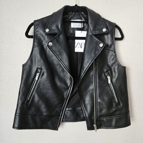 This Stylish Zara Vest Is Perfect For Girls Who Love To Travel Or Need A Casual Outfit. The Vest Features A Solid Black Color With A Biker Style That Includes Accents Like Zipped Pockets And A Full Zip Closure. The Mid-Length And Sleeveless Design Make It Perfect For Fall And All Seasons. The Vest Is Made Of Faux Leather Fabric Type With A 100% Polyester Outer Shell Material And A 1% Viscose Lining Material For Easy Care. It Is Not Handmade And Comes With A Brand Name Of Zara. The Vest Is Perfec Cropped Leather Vest, Baby Fur Vest, Puffer Vest With Hood, Kids Puffer Vest, Navy Blue Vest, Zara Vest, Kids Vest, Boy Outerwear, Brown Vest