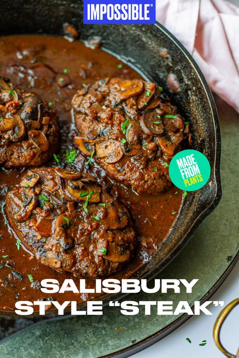 This Impossible™ Salisbury-Style “Steak” recipe is the meatier, grown-up version of this classic dish. The recipe calls for Impossible™ Burger steaks, smothered in a rich umami mushroom gravy that will have your entire family craving a second serving. Hearty, tender, and flavorful – it's the perfect way to end the evening! Find more recipes from Meiko on at @meikoandthedish! Vegan Salisbury Steak Beyond Meat, Impossible Steak Recipe, Impossible Salisbury Steak, Vegetarian Salisbury Steak, Vegan Hamburger Steak, Vegan Salsberry Steak Recipe, Plant Based Steak Recipes, Grown Beef Recipes Dinners, Vegan Pepper Steak