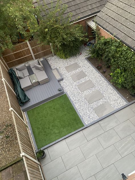 Stepping stones with large porcelain slabs and fake grass, a room for plants with a bed at the side. Garden With Slabs And Decking, Garden Ideas Stones, Fake Grass Garden Ideas, Garden Slabs Ideas, New Build Garden Ideas, Fake Grass Backyard, Room For Plants, Garden Slabs, Garden Transformation