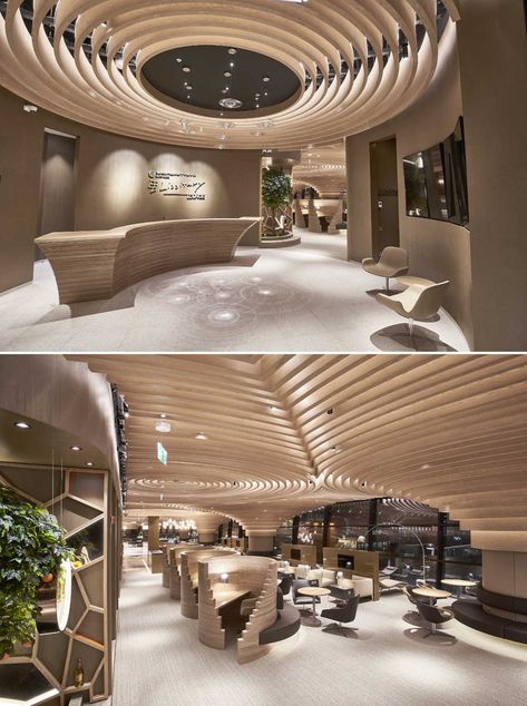 This Sculptural Wood Ceiling Evokes The Feeling Of Motion, Which Is Appropriate Since It's In An Airport Wavy Ceiling, Modern Airport, Lounge Interiors, Circular Lighting, Ceiling Plan, Timber Ceiling, Airport Lounge, Column Design, Wood Ceiling