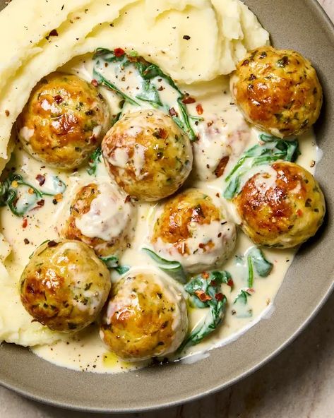 Parmesan Chicken Meatballs with Creamy Spinach Recipe | The Kitchn Chicken Meatballs Pasta, Cook Ideas Easy, Easy Chicken Meatballs Baked, Chicken Meatballs And Mashed Potatoes, Creamy Chicken Meatballs, Chicken Meatball Recipe Main Dishes, Dishes With Mashed Potatoes, Meat Entrees Main Dishes, Chicken Meatball Meals