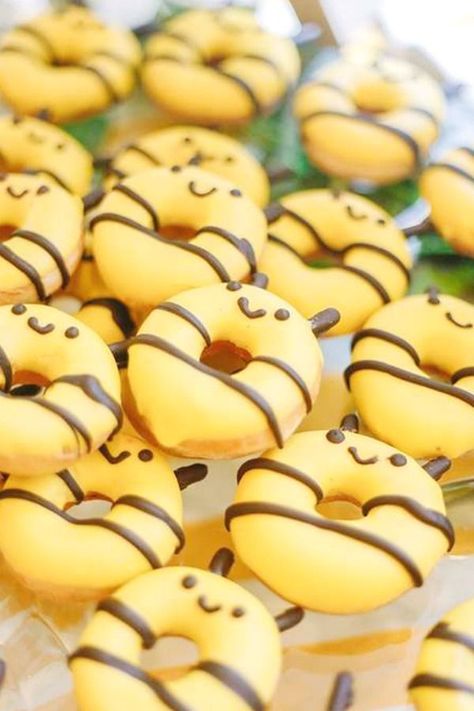 Take a look at this beautiful bumblebee birthday party! The bee donuts are adorable!  See more party ideas and share yours at CatchMyParty.com  #catchmyparty #partyideas #bumblebees #bumblebbeparty #donuts Bumblebee Birthday Party, Bumblebee Birthday, Bee Birthday Theme, Bee Themed Gender Reveal, Black Icing, Bee Themed Birthday Party, Donut Decorating Ideas, Bee Food, Edible Eyes