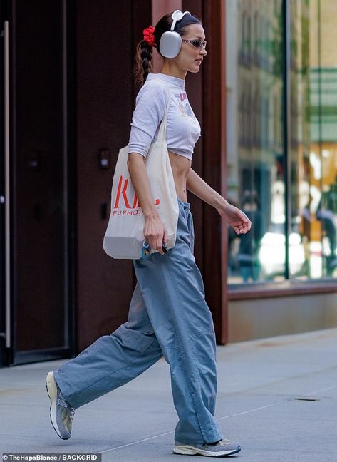 Staying comfortable: The social media powerhouse also rocked a wide-legged pair of pants and a set of New Balance running shoes Bella Hadid Nike, Straight Pants Women, Virgo Rising, Vintage Tracksuit, 2022 Outfits, Varsity Jacket Women, Summer Pants Women, Bella Hadid Outfits, Bella Hadid Style