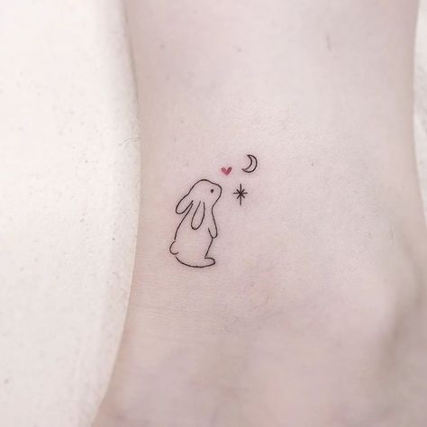 20  Enchanting Mini Rabbit Tattoo Designs for Your Inspiration - WomenSew Outline Bunny Tattoo, Bunny Stamp Tattoo, Bunny Matching Tattoo, Mini Bunny Tattoo, Bunny Line Tattoo, Dainty Bunny Tattoo, Fine Line Rabbit Tattoo, Baby Bunny Tattoo, Matching Penguin Tattoo