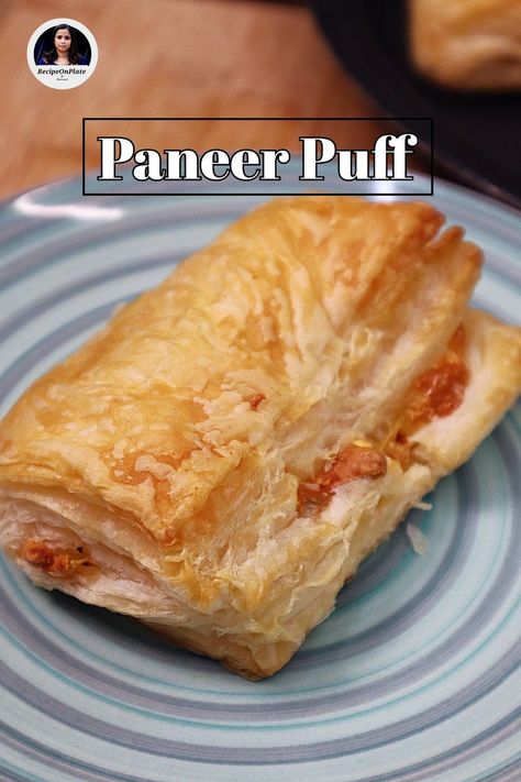 It's a fusion of Indian and Western culinary influences, combining the rich and creamy texture of paneer with the light and buttery layers of puff pastry. Ingredients for Paneer Stuffing: - ¼ cup Shredded Paneer - 3 tbsp Capsicum (diced) - ½ tsp Oregano - ½ tsp Chilli flakes - 1 piece Cheese slice - Salt to taste For Puff Pastry: - 4 sheets (10cm x 10cm) Puff pastry sheets https://recipeonplate.com/paneer-puff/ Enjoy your homemade Paneer Puffs as a delightful snack or appetizer! #recipeonp Paneer Puff, Puff Pastry Ingredients, Homemade Paneer, Cheese Slice, Puff Pastry Sheets, Pastry Sheets, Chilli Flakes, Creamy Texture, Gold Coin