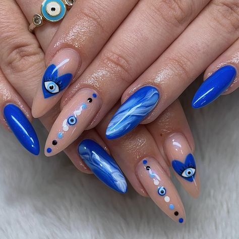 evil eye nails 🧿🫶🏼✨💙 acrylic fill w/ nail art done on tja brand ambassador @tayxanne <3 @youngnailsinc - cover pink @dndgel @dndgel.europe - dc 055 black ocean - dc 056 white chalk - dc 027 pittsburgh blue - dc 030 aqua blue @apresnailofficial - heavenly top coat divine #evileye #evileyenails #evileyenailart #evileyenails🧿 #bluenails #bluenailart #blueacrylics #marblenails #chromenails #bluechromenails #acrylicnails #longacrylicnails #almondnails #ontariocanada #youngnails #youngnails... Blue Eye Nail Art, Almond Nails Evil Eye, Red Evil Eye Nails, Hamsa Nails, Ojo Nails, Pink Evil Eye Nails, Turkish Eye Nails, Egyptian Nail Art, Nails Evil Eye