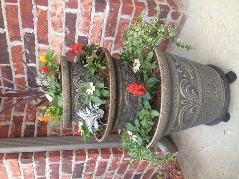 My new 3 tier planter. I love it! Tiered Planter Ideas, 3 Tier Planter, Outdoor Metal Plant Stands, Metal Plant Stands, Front Porch Flower Pots, Flower Pot Ideas, Front Porch Flowers, Clay Planter, Tiered Planter