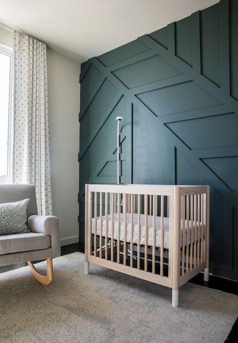 The decor of this baby nursery is future proof. While a charming room for a little one, the colour palette and the deep green panelled feature wall mean that a simple swap out of the furniture means an older child will feel just at home. Green Panelled Wall, Boys Bedroom Wall Color, Panelled Feature Wall, Custom Millwork, Baby Boy Room Decor, New Rochelle, Bedroom Wall Colors, London Apartment, Luxury Interiors