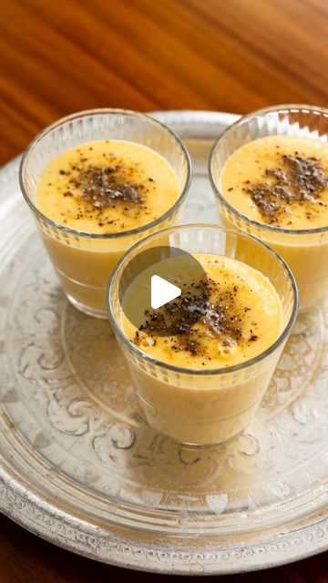 Ray McVinnie on Instagram: "My Mango Lassi

Serves 4
This is my version of the Indian classic lassi. It is a great smoothie or even a dessert.

2 mangoes, 
3 tablespoons sugar
1 teaspoon cardamom seeds (no pods)
1 1/2 cups iced water
1 1/2 cups plain unsweetened yoghurt (I used @thecollectivenz )
handful ice cubes

Slice the mangoes away from the stone and peel.
Place in a blender with 2 tablespoons of the sugar.
Grind the remaining sugar and cardamom seeds in a mortar or spice grinder or chop the cardamoms finely with a large knife and mix with the sugar.
Reserve.
Add the water to the blender and blend until smooth.
Add the yoghurt and ice and blend until smooth.
Pour into glasses and sprinkle some of the cardamom sugar on top of each. 
Serve.
.
.
.
#mango #lassi #cardamom #chef #recipe # Cardamom Seeds, Iced Water, Mango Lassi, Spice Grinder, Indian Recipes, Ice Cubes, Healthy Smoothies, 2 Cups, Indian Food Recipes