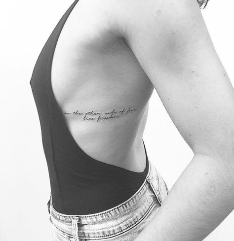 On the other side of fear lies freedom Rib Tattoos For Women Quotes, Rib Tattoos Words, Rib Tattoo Quotes, Side Tattoos Women, Handwriting Tattoos, Tattoos On Side Ribs, Freedom Tattoos, Rib Tattoos For Women, Waist Tattoos