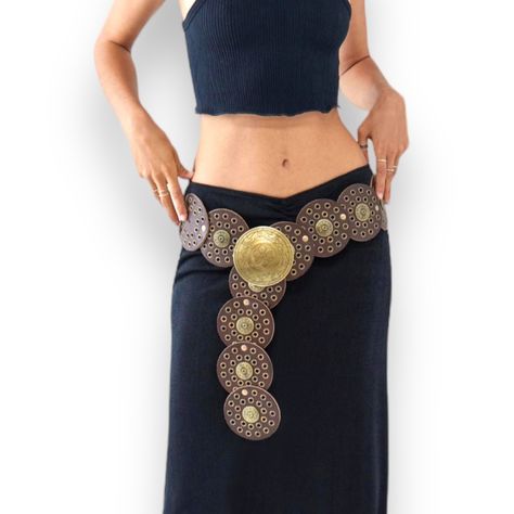 Elevate Your Fashion Attire With This Beautiful Brown Concho Medallion Linked With Antiqued Brass Studded And Rivets! Embellished Boho Western Festival Statement Belt With Floral Engraved Matching Buckle! Measures Approximately Women’s Size Small, Medium, Large Belt Length: 39” Conchos & Buckle Diameter: 3.5” Material: Split Leather, Metal Buckle Upc1013232 Concho, Western, Festival, Wide Belt, Adjustable Belt, Wear Around Your Hips Or High Figure Flattering Waist! Statement Belt, Fashion Belt F Medallion Belt Outfit, Disk Belt Outfit, Unique Belts, Medallion Belt, Chain Body Harness, Black Waist Belt, Large Belt, Boho Belt, Western Festival