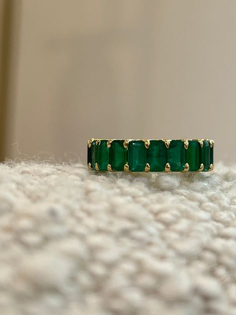 18K gold in your choice of White or Yellow 6.65 ctw (for size 6) of natural green emeralds, stones measure 5mm x 3mm U-ternity style setting Handmade in New York *If other size is needed, please indicate desired size in note box at checkout. Gold Rings With Emeralds, Emerald Gold Wedding Ring, Emerald Wedding Bands For Women, Green Emerald Wedding Band, Emerald Stone Wedding Band, Gold And Emerald Wedding Ring, Emerald Green Wedding Band, Emerald Green Rings, Emerald Green Wedding Ring