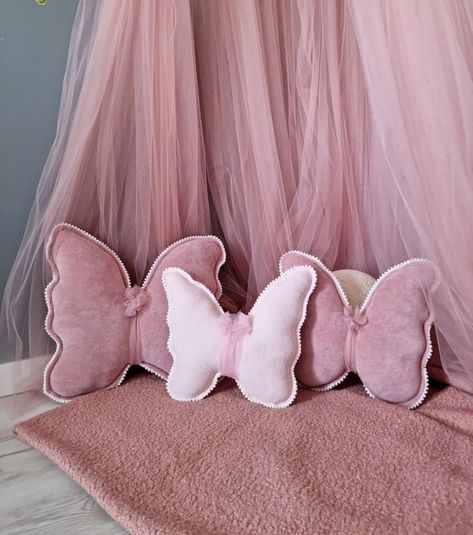 Like the pillows Pink And Black Nursery Girl, Purple Butterfly Nursery Baby Girl, Rose Themed Nursery, Butterfly Room Aesthetic, Pink Pillows Living Room, Daughter Room Ideas, Butterfly Toddler Room, Pink Butterfly Room, Butterfly Room Ideas