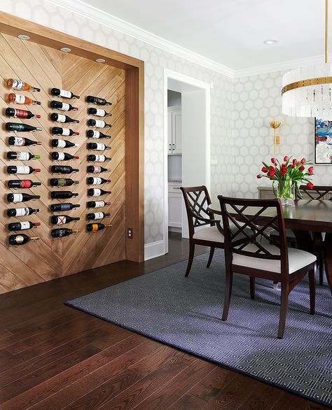 For clients with an impressive wine collection, a custom wine display was the perfect opportunity to make a statement! 🍷 We had a blast creating a feature wall with millwork and recessed lighting. Acrylic pegs give the illusion of floating bottles for a true “wow” moment.⁠ ⁠ Photo : @mcbecks_pix Wine Wall Dining Room, Wine Dining Room, Dream Cottage Interior, Stone Interior Design, Wine Wall Display, Wall Nook, Stone Interior, Wine Wall, Wine Display