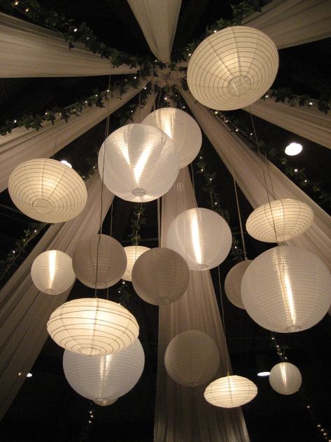 I will always have a fascination with paper lanterns hanging together in bunches... Paper Lighting, Wedding Chandeliers, Marquee Decoration, Lantern Light Fixture, Soft Wedding, Wedding Ceiling, Paper Lantern Lights, Floating Lanterns, Lantern Ideas