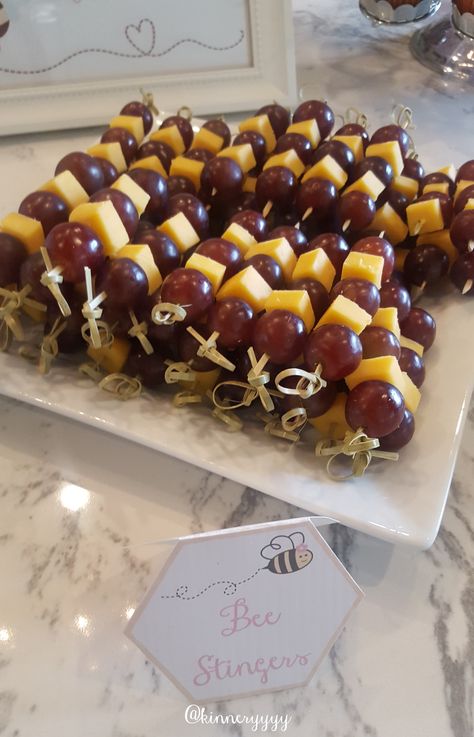 Bee Inspired Party Food, Bee Stingers Fruit, Bee Bridal Shower Theme Food, Bridal Shower Honey Bee Theme, First Bee Day Party Food Ideas, Honey Bee Gender Reveal Food, Honey Themed Party Decor, Honey Bee Baby Shower Food Ideas, What Will It Bee Gender Reveal Food