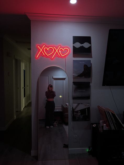 "Add a touch of warmth and romance to any space with our XOXO LED Neon Sign! Crafted with love and attention to detail, this sign features vibrant LED lights designed in the shape of XOXO, with heart-shaped O's exuding an irresistible charm. Perfect for bedrooms, living rooms, or even as a stunning centerpiece for events, our neon sign creates an ambiance that's both cozy and chic. The soft glow of the LEDs adds a subtle, yet captivating allure to any room, setting the mood for memorable moments Neon Sign Decoration, Led Sign In Bedroom, Led Light Above Bed, Wall Collage With Neon Sign, Seductive Room Decor, Bedroom Inspo Trendy, Jordyn Lenae Room, Cozy Neon Bedroom, Red Led Sign