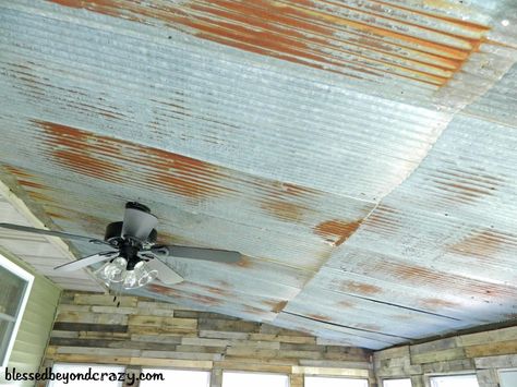 Tin ceiling inside a sun room and pallets on the walls. Very rustic and basically FREE. A great room to entertain or relax in. From blessedbeyondcrazy.com Porch Ceiling Ideas Cheap, Man Cave Ideas Cheap, Tin Ceilings, Barn Tin, Rustic Basement, Porch Ceiling, Man Cave Basement, Sun Porch, Ceiling Ideas