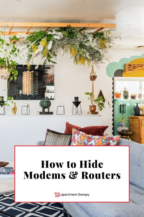 Discover how to hide unsightly Wi-Fi modems and routers with these designer tips. Hiding Electronics Living Rooms, Hide Router And Modem Wall, Hide Cords Behind Tv, Internet Router Shelf, How To Hide Internet Router And Cords, Wifi Hiding Ideas, Ways To Hide Internet Router, Hide The Tv Ideas, Hiding Xbox Console