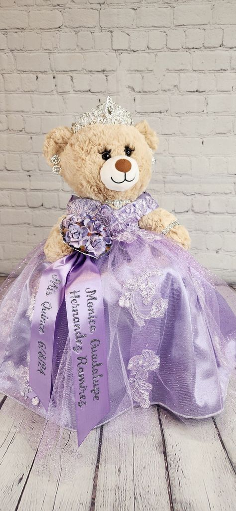 Custom Personalized Quinceanera Bear/Last Doll/Oso made to look just like the quinceanera's dress. Attention to detail is my forte.  Includes the 20" bear, dress, tiara, lashes, bouquet and jewelry. Please allow more than 8 weeks to make the bear.  May be longer during peak season.  Please message me with the following information: - Pictures of the front and back of the dress. - Color description as sometimes the pictures may appear differently.  - Date of the Quinceanera - Color of accessories (silver, gold, rosegold) - If you need it sooner than 8 weeks, please select the Rush Fee and add it to the cart. - If you would like the additional accessories, please add the accessory upgrade to the cart.  Upgrade includes metal tiara with stones, heels to match her dress, and doll stand so that Quinceanera Bear Purple, Quinceanera Doll Purple, Tangle Quinceanera Theme, Sofia The First Quinceanera, Quince Last Doll, Repunzel Quince Theme, Rapunzel Theme Quinceanera, Lavender Quince Dress, Light Purple Quinceanera