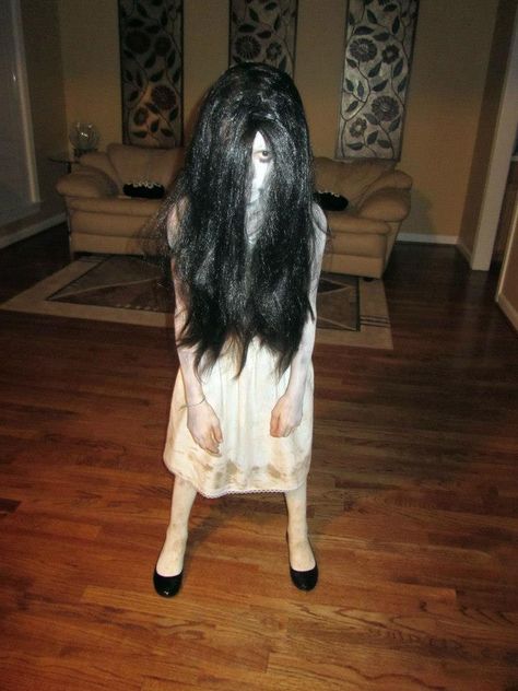 Halloween Costume.  DIY Samara from The Ring.  White Tights and Goodwill white dress.  Literally dragged them through the dirt. Black flats, black wig.  Watched a tutorial on how to do her make up. Zombie Halloween Costumes, Creepy Halloween Costumes, Villain Costumes, Zombie Costume, Halloween Express, Scary Halloween Costumes, Black Wig, Zombie Halloween, Halloween Costume Contest