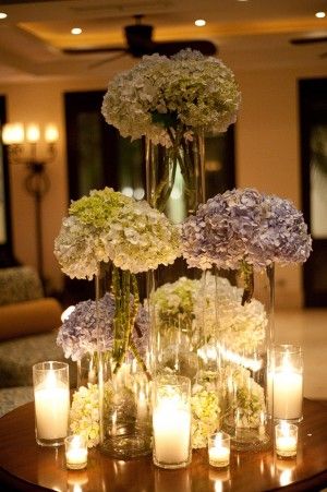 Hydrangeas & Candles - amazingly beautiful yet simple centerpieces Centerpieces Hydrangea, Hydrangea Centerpieces, Flowers In Vases, Flowers And Candles, Hydrangea Centerpiece, Tafel Decor, Event Lighting, Deco Floral, Wedding Table Centerpieces