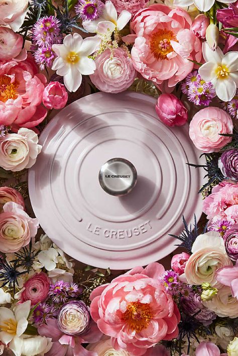 A bed of flowers with the new Le Creuset color way - Shallot - a Dutch oven in a fresh light lilac color displayed on top. Cast Iron Braiser, Le Crueset, Elegant Dinners, Cast Iron Oven, Creamy Blush, Blackberry Crumble, Le Creuset Dutch Oven, Le Creuset Cookware, Elegant Dinner