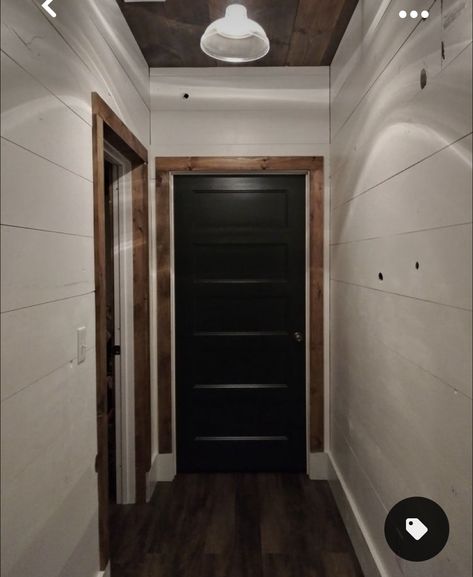 Black Doors Wood Trim Interior, Interior Dark Trim Light Walls, Black Interior Farmhouse Doors, Black Doors With Wood Trim Interior, Black Doors Wood Trim, White House Black Trim Wood Accents Interior, Black Doors With Wood Trim, Black Interior Doors With Wood Trim, Hallway With Black Doors