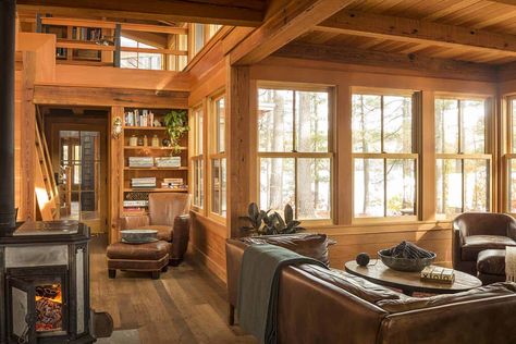 Off-the-grid island camp surrounded by breathtaking woods in Maine Cabin Inspired Interior, Small Camping Cabin Ideas, Wood Themed House, Antique Decorated Home, Tiny House Wood Stove Cabin, Small Sitting Room With Wood Stove, Home In Woods Aesthetic, Cozy Tiny Cabin, Tiny Cabin Living Room