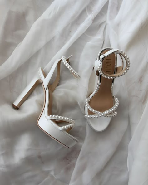 Eva by HARLO Australia feature a luxurious satin finish, adorned with classy pearl accents. The cross over open toe and open heel ankle strap design creates a modern and sophisticated look whilst keeping your feet cool and breathable throughout your wedding day. This is the perfect shoe for brides who want both style, height and comfort on their special day. The Eva pairs beautifully with any pearl accessories or gown accents. Made for all day comfort, these slim designed high block heels are le Bridal Heels With Pearls, High Heel Wedding Shoes Brides, Bridal Shoes Block Heel Platform, Wedding High Heels Brides, Engagement Shoes Brides, Beautiful Wedding Shoes Brides Heels, Bridal Shoes With Pearls, White Bridal Shoes Block Heel, Comfortable Wedding Heels For Bride