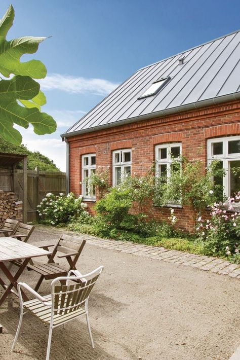 The location and the fine combination of titanium zinc, wood and bricks turn the former customs house into something truly special.// RESIDENTIAL BUILDING ALLINGE BORNHOLM, DENMARK /Design Architect: Algreen Arkitekter, Virum, Danmark / Supervising Architect: Algreen Arkitekter: Virum, Danmark / Technical Specifications Roof: 200 m² 1.3 t Double Standing Seam #RHEINZINK- #prePATINA blue-grey Reference Objects, Denmark House, Zinc Roof, Design Architect, Standing Seam, Roofing Systems, Residential Building, Architect Design, Garden Wall