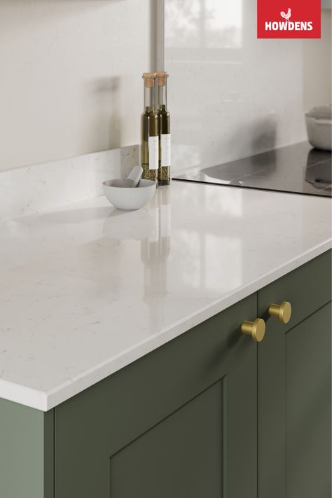 Looking for kitchen worktop ideas or white kitchen countertops? Enhance your traditional kitchen design with the bright tones of our Howdens Bespoke Silestone Miami Vena Marble Quartz Worktop. Pair our quartz worktop kitchen with green kitchen cabinets and brushed brass kitchen hardware. Our marble worktop kitchen is hardwearing and a great option for those looking to introduce a luxurious look for less. Add a matching quartz upstand to finish your contemporary kitchen design. Kitchen Ideas White Worktop, Miami Vena Quartz Countertops, Quartz Upstand, Quartz Worktop Kitchen, Silestone Miami Vena Quartz, White Worktop Kitchen, White Quartz Worktop, Miami Vena Quartz Kitchen, Miami Vena Quartz