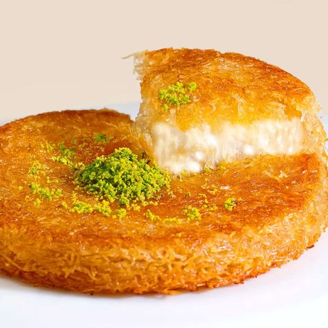 Kanafeh is a traditional Middle Eastern dessert made with shredded filo pastry, or alternatively fine semolina dough, soaked in sweet, sugar-based syrup, and typically layered with cheese, or with other ingredients such as clotted cream or nuts. The taste is delicate, creamy, and only subtly sweet. When you want to try a dessert that has pleased palates for generations, nothing hits the spot like kunafa. Kunafa Recipe, Vermicelli Recipes, Middle Eastern Desserts, Turkish Desserts, Around The World Food, Turkish Food, Angel Hair, No Cook Desserts, Turkish Recipes