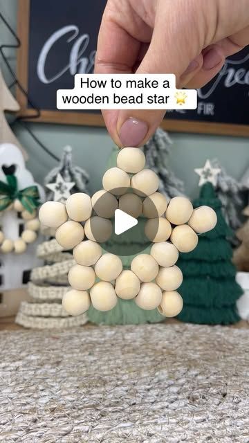 Caroline Fleming on Instagram: "Wooden Bead Star 🌟 
You will need 25 wooden beads in total to make the star I used 15mm size beads. 
#beadstars #woodenbead #christmascraftideas #woodenbeadcrafts #diychristmascrafts #diychristmasdecoration" Diy Bead Ornaments Christmas, Wooden Bead Garland Decor Ideas, Wood Bead Ornaments Diy, Wooden Bead Christmas Ornaments, Wooden Bead Crafts, Bell Ornaments Diy, Wooden Beads Crafts, Wooden Bead Star, Caroline Fleming