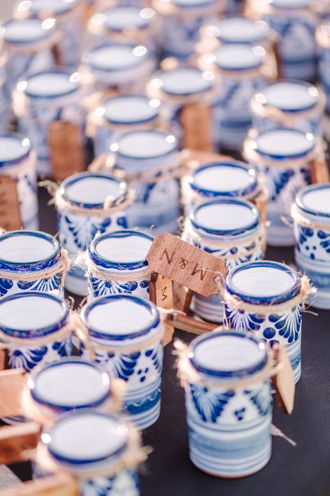 Blue and white talavera shot glasses pictured with the bride and groom's initials tagged. Wedding Favors For Guests Mexican, Mexico Wedding Party Favors, Blue Hacienda Wedding, Wedding Favors Mexican, Mexican Favors Ideas, Mexican Wedding Party Favors, Blue And White Talavera Wedding, Colombian Wedding Ideas, Blue Talavera Wedding