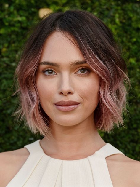 Add a pop of color to your autumn look with this Fall haircut featuring soft pink highlights. The subtle ombré effect gives this bob a trendy twist, perfect for those who want to experiment with color without going too bold. The waves add volume and movement, making it a versatile style that works well for both casual and formal occasions. Soft Pink Highlights, Bob Hair Color Ideas, Ombre Bob Hair, Deep Brunette, Fall Haircut, Short Balayage, Dark Balayage, Edgy Hair Color, Hair Color Ideas For Fall