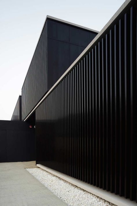 Shelter Home for the Homeless,© Iñaki Bergera محطة وقود, Black Architecture, Corrugated Steel, Black Building, Black Houses, Metal Facade, Minimal Architecture, Building A Container Home, Industrial Architecture