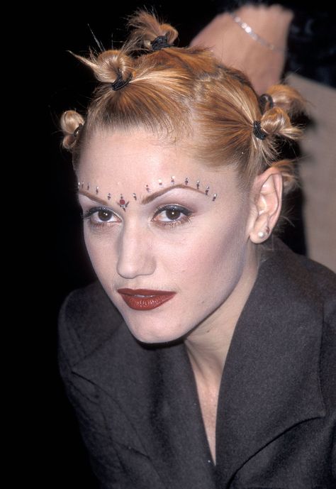 It's hard to believe we ever thought Gwen Stefani bantu knots were in style, we wouldn't recommend going to the hair salon asking for this look today!  #GwenStefani #90shair #badhairday 90s Updo, Brandy Braids, Stacked Hairstyles, Danielle Fishel, 90’s Hairstyles, 90s Makeup, Hair Catalog, All Hairstyles, Top Hairstyles