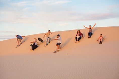 Sandboarding at Stockton Sand Dunes. We love sandboarding! So many hills, unlimited rides, and best of all, fun for the entire family. We look forward to showing you our backyard.  #stocktonsanddunes #portstephens #sandboarding #birubibeach #australia #annabay #4wdtoursrus #familyfun Surfing Photoshoot, Huacachina Peru, Desert Shoot, Quad Biking, 2023 Beach, Port Stephens, Desert Safari Dubai, Dubai Tour, Desert Photography